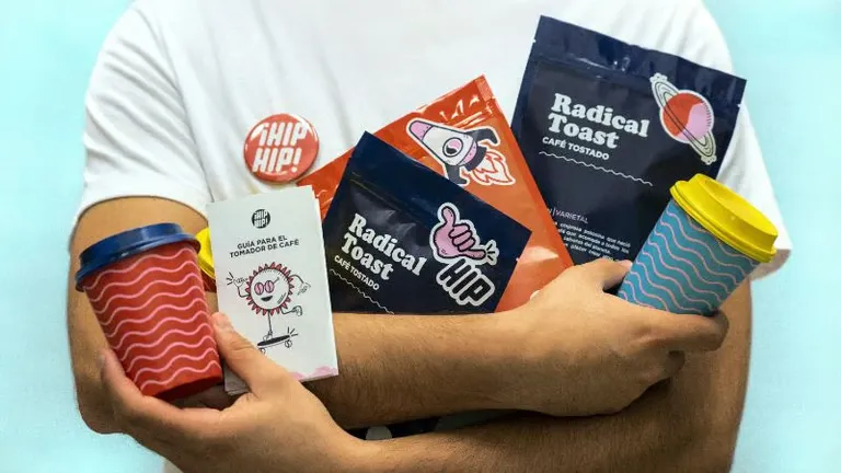 A person holding various branded items.